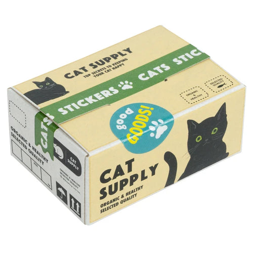 A cardboard box labeled "Japanese Mini Sticker Box Cat Supplies" by Blue Dog Posters features a black cat illustration, green "STICKERS CATS" text, and a blue "good GOODS!" circle, promoting organic, healthy, selected quality supplies.