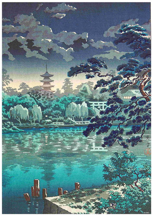 A serene scene features a pagoda rising above a dense forest, with a lake reflecting the surrounding trees and cloudy sky. A traditional Japanese torii gate is visible among the trees. In the foreground, a pine tree and a few wooden posts stand near the lake's edge, beautifully captured in an A3 poster of "Tsuchiya Koitsu - Shinubazu Pond" on 250gsm Satin Paper.