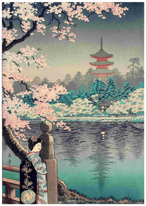 A woman in a traditional kimono stands by a railing overlooking a serene lake. Cherry blossom trees in full bloom frame the scene. Across the lake, a pagoda and temple are visible amidst lush greenery under a tranquil sky. This high-quality 250gsm Satin Paper A3 poster, titled "Tsuchiya Koitsu - Geisha and Cherry Tree," captures classic Japanese art beautifully.