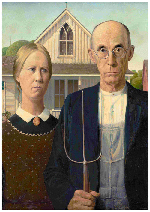 A man and a woman stand in front of a house with a Gothic-style window, captured in the timeless elegance of classic art posters titled "American Gothic by Grant Wood," offered by Brand Y. The man holds a pitchfork and wears overalls with a dark jacket, while the woman dons a brown dress with a patterned collar. The background features trees and clear skies.