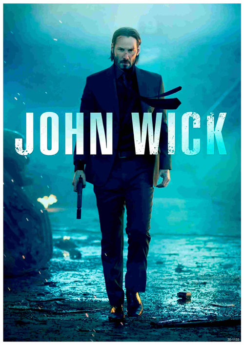 A man in a suit holding a gun strides forward amid fire and debris under blue, dramatic lighting. Bold text displays “John Wick,” the A3 brand’s latest release.