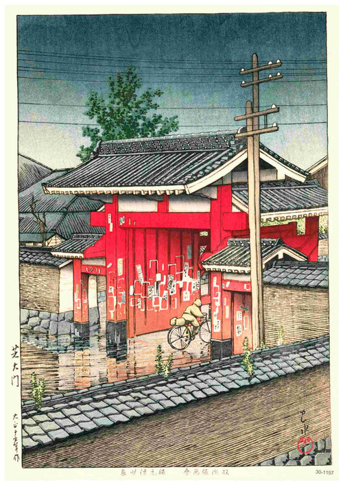 A bicycle is parked by a stone wall in front of a traditional Japanese red gate, with "Shiba Great Gate by Hasui" A3 posters on its pillars. Wooden power lines, trees, and rooftops fill the cloudy sky above.