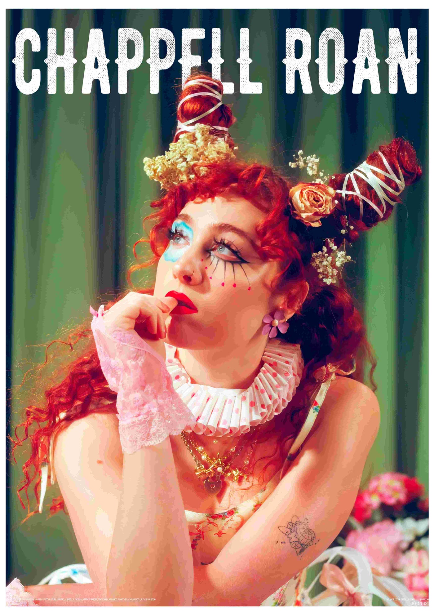 A person with red curly hair in two buns adorned with flowers sits thoughtfully, wearing dramatic makeup, a ruffled collar, and lacy gloves. Ideal for music fans, this A3 satin Chappell Roan poster by Blue Dog Posters features "CHAPPELL ROAN" text above.