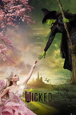 A theatrical poster titled "Wicked" from MTV 098 displays a scene with a green-skinned witch on a broom extending her hand towards a blonde woman in a pink dress holding a wand. The backdrop reveals an enchanting landscape adorned with castles and cherry blossoms, accompanied by the tagline "Everyone deserves the chance to fly.