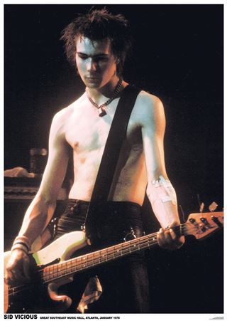 MUS 095 presents "The Sex Pistols - Sid Vicious": a shirtless, spiked-hair Sid plays bass on stage with a bandaged arm and dramatic lighting—an intense addition to any music or Rock Poster collection.