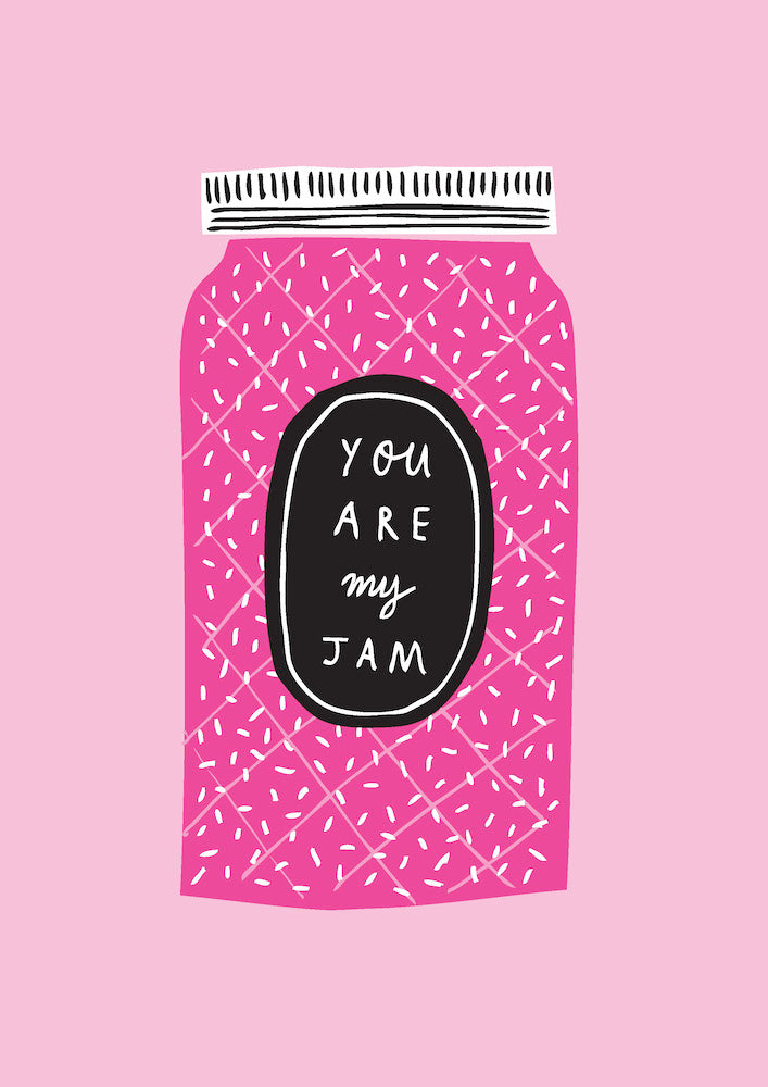 A pink jam jar with a black label on a pink background, inspired by Mid Century Graphic Design. The label says "YOU ARE my JAM" in white handwriting. The simple, patterned design with white dots and lines showcases Badger & Burke's playful style from Vancouver Canada under Blue Dog Posters.