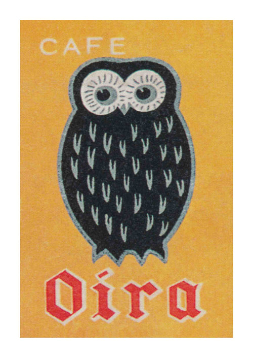 An illustration of a stylized black owl with white eyes and feather details on a yellow background features "Café" on top and "Oira" in red, stylized letters at the bottom. Product: Café Oira Owl by Blue Dog Posters.