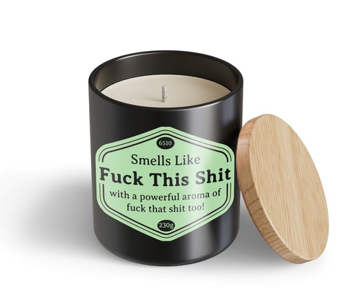 The Fuck This Shit Candle Hustle & Co by Blue Dog Posters is a black jar with a wooden lid and green label reading: "Smells Like Fuck This Shit" with a bold aroma of "fuck that shit too!.