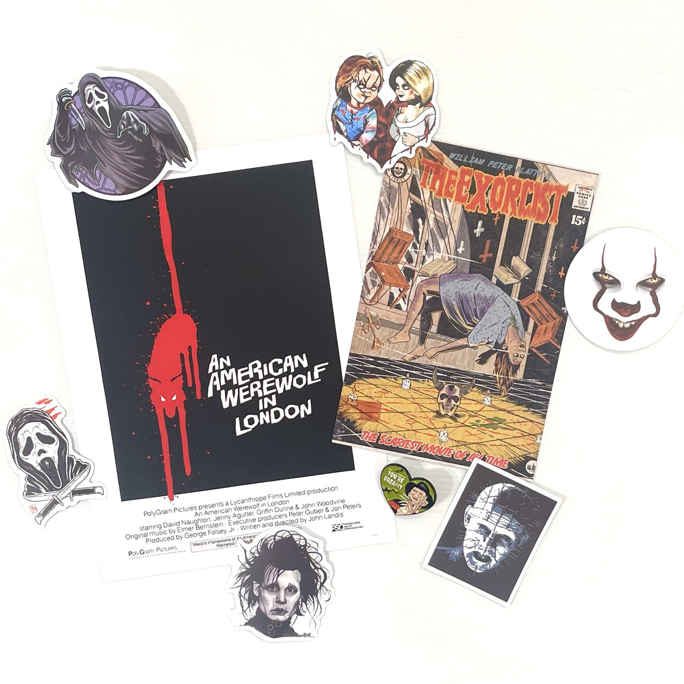 The Mystery Goodie Bag - Vintage Horror by Blue Dog Posters features horror-themed stickers, prints, and enamel pins, with vintage movie art from "An American Werewolf in London," "The Exorcist," plus Ghostface, Pennywise & Pinhead stickers.