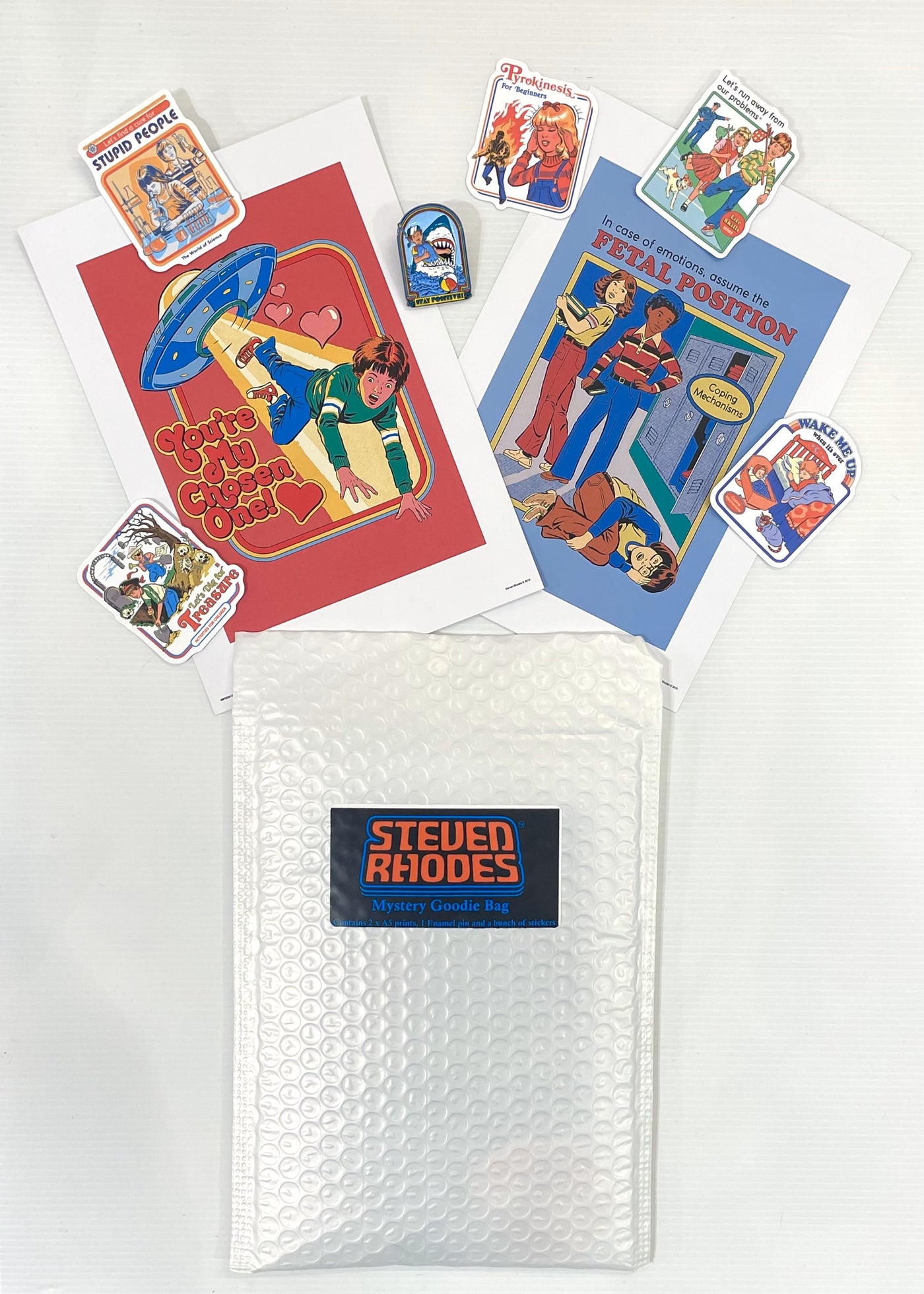 The Mystery Goodie Bag - Steven Rhodes by Blue Dog Posters includes two colorful retro-style prints and quirky stickers with humorous, vintage-inspired designs, all displayed on a white background.