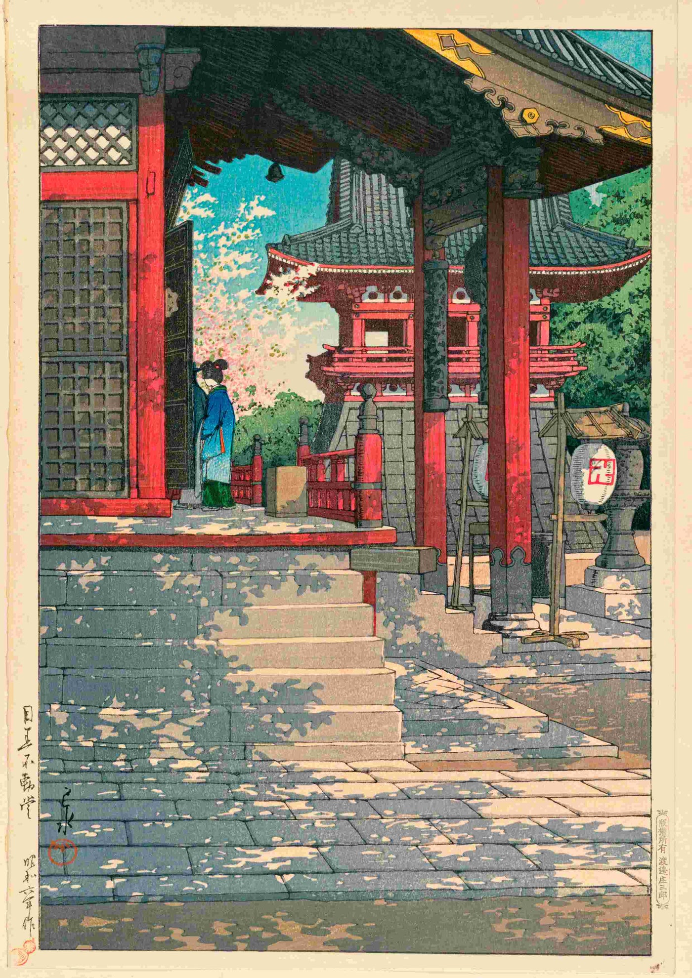 A person in blue stands by the entrance of a traditional temple with red pillars and stone steps, echoing the scene from "Fudo Temple in Meguro by Kawase Hasui"—a Japanese art poster from Blue Dog Posters.
