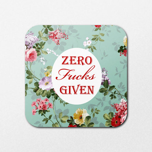 The Zero Fucks Coaster by Blue Dog Posters features a square design with a light green floral background. A white circle in the center displays "ZERO Fucks GIVEN" in red, surrounded by colorful flowers.