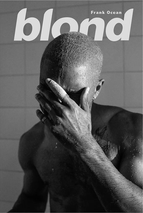 A premium 150gsm gloss paper poster titled "Frank Ocean Blonde B & W" by Blue Dog Posters showcases a striking black and white image of a person standing under running water, with one hand shielding their face. The names "Blond" and "Frank Ocean" are elegantly inscribed above, set against a backdrop of intricate tile patterns, making it an ideal addition to any music collection or Hip Hop poster display.