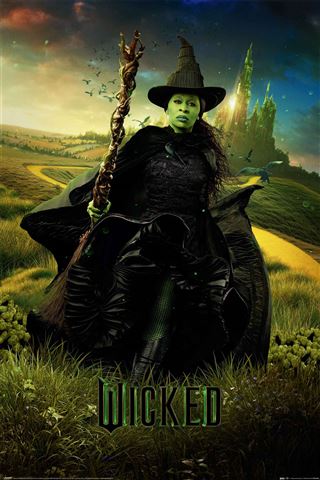 A mysterious character named Elphaba, dressed as a green-skinned witch with a pointy black hat, holds a staff and stands in an enchanted landscape featuring a yellow brick road and distant castle. "Wicked" is displayed at the bottom of this MTV 397 product image.