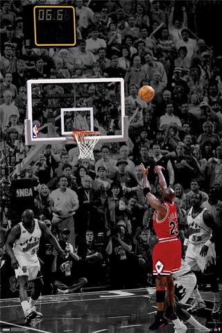 A high-quality printing captures a basketball player wearing a red and black uniform with the number 23 taking a jump shot with 6.6 seconds left on the game clock. The image, perfect for any Sport Collection, shows the player mid-air, with the ball about to reach the hoop against a stadium crowd backdrop. This artwork is titled "Michael Jordan The Shot" by SPO 013.