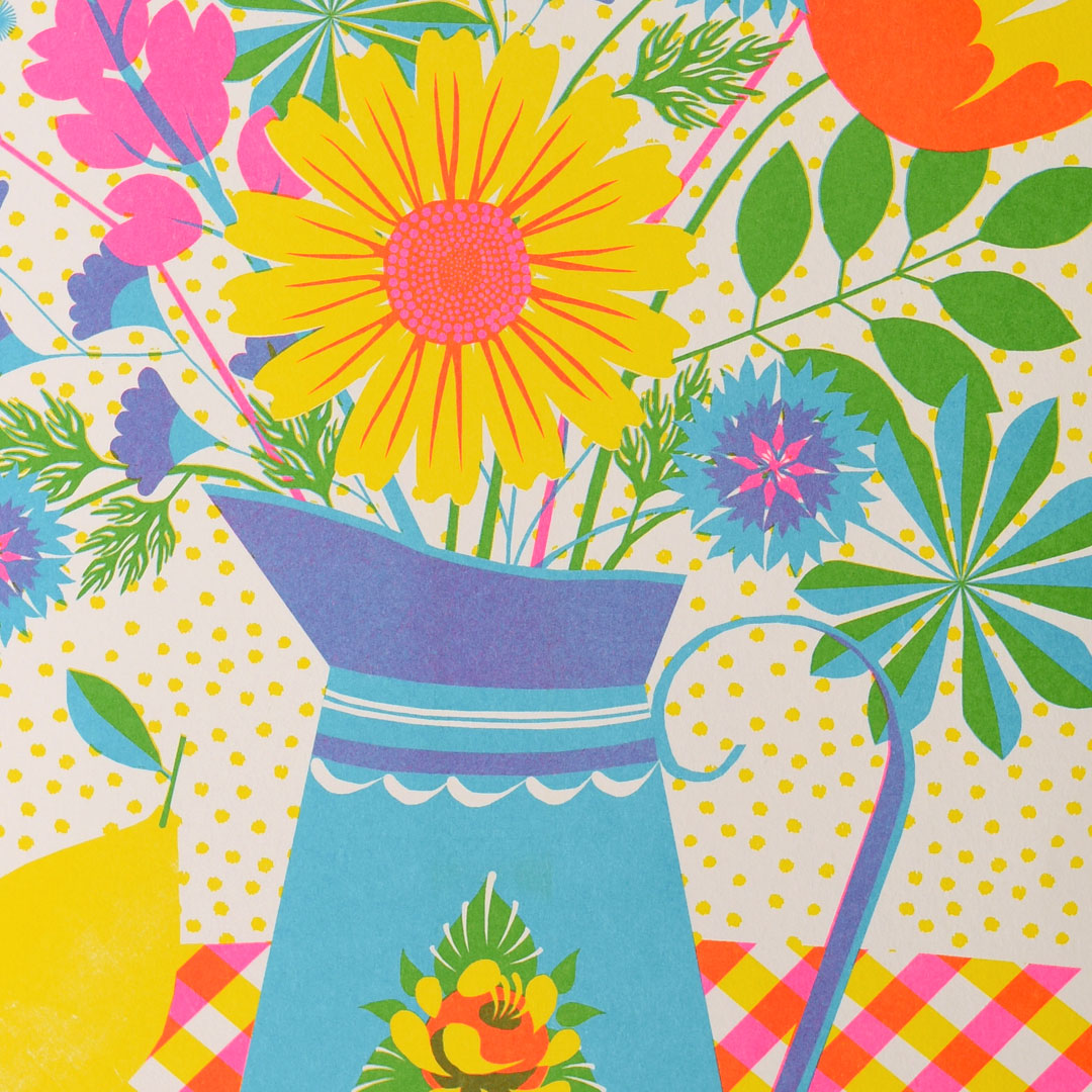 Experience the vibrant "Summer Bloom Riso" by Printer Johnson, offered by Blue Dog Posters. This risograph print features a stunning illustration of a floral arrangement in a blue vase, using eco-friendly soy-based inks. The design includes a playful yellow polka dot background and rests on a red and yellow checkered tablecloth. A large sunflower takes center stage among the bright flowers that burst with color.