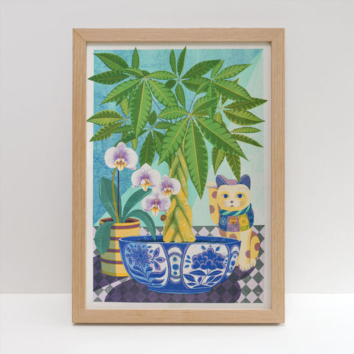 The Money Tree Riso Print by Printer Johnson, available from Blue Dog Posters, showcases a potted palm, orchids, and a maneki-neko figurine resting on a patterned table. This framed Risograph print features a gradient background transitioning from blue to green that enhances the vibrant colors of the plants and the blue floral bowl. All elements are printed with eco-friendly inks for an environmentally conscious touch.