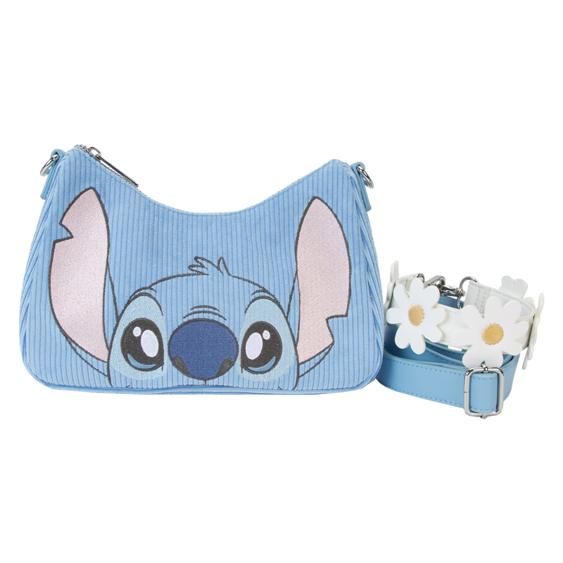 The Lilo & Stitch Springtime Daisy Crossbody by Blue Dog Posters is a blue shoulder bag adorned with a cartoon face resembling Stitch on the front. This Disney product features a detachable strap decorated with white daisy flowers and is crafted from premium vegan leather, making it both stylish and environmentally friendly.