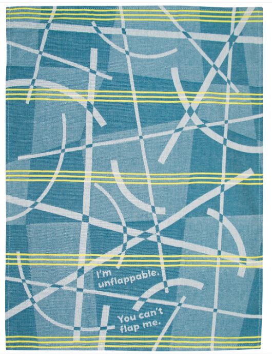 The "Im Unflappable Dish Towel" from Blue Dog Posters, featured in our Homewares Collection, showcases a blue rectangular textile with abstract white and yellow diagonal lines. The design is intersected by green and yellow horizontal stripes. This high-quality cotton tea towel includes the text "I'm unflappable. You can't flap me.