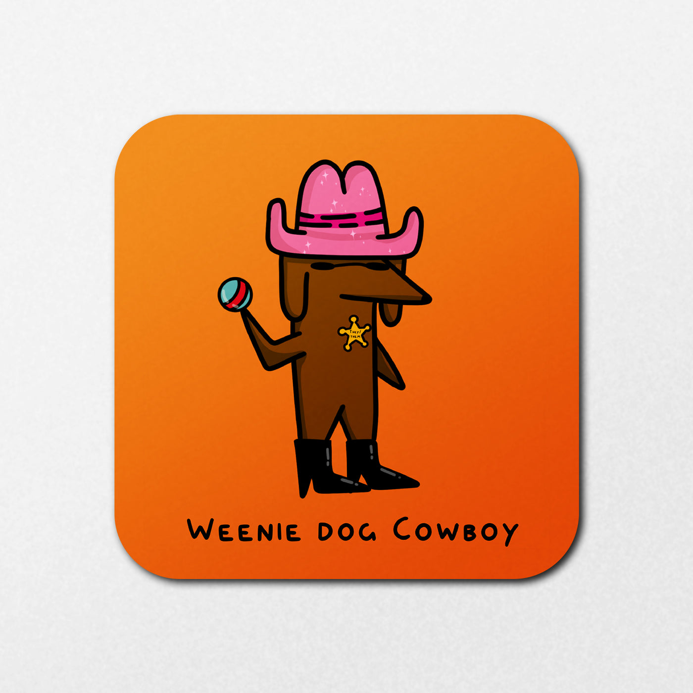 Cartoon of a brown dachshund wearing black boots, a pink cowboy hat, and a sheriff badge, holding a lollipop on an orange background. Text says "WEENIE DOG COWBOY" at the bottom. Product Name: Weenie Dog Cowboy Coaster by Blue Dog Posters.
