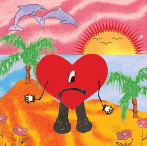 The "Bad Bunny" large regular poster by MUS 153 features an illustration of a sad heart with arms and legs standing on a beach. Behind it, there's a vibrant sunset with a yellow and orange sun, pink clouds, palm trees, and two dolphins leaping against the colorful sky, while flowers adorn the sandy ground below.