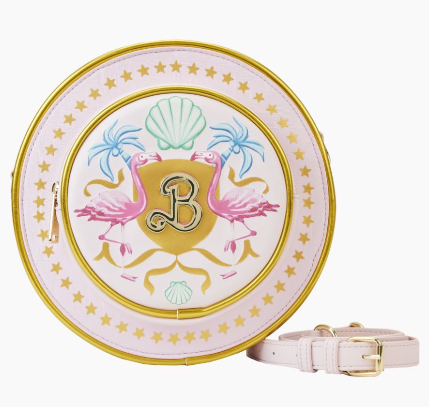 This Barbie the Movie Logo Crossbody Bag by Blue Dog Posters is a pink and gold round handbag adorned with an intricate design featuring two pink flamingos, a seashell, and an ornate letter "B" at the center. The bag is equipped with a gold zipper, a pink strap with a gold buckle, and boasts a star pattern around the edge.