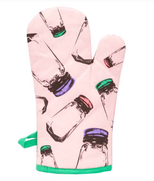 Presenting the "Oven Mitt - Secret Ingredient" by Blue Dog Posters: a super-insulated pink oven mitt adorned with green trim and equipped with a convenient hanging loop. Crafted from 100% cotton, it boasts an enchanting pattern of multicolored bottle illustrations featuring caps in red, green, blue, and purple scattered across the surface.
