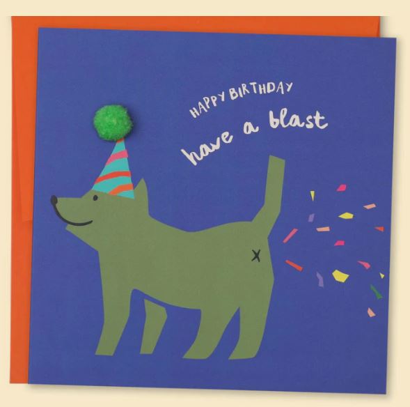 A birthday card from Blue Dog Posters, named "Happy Birthday Have A Blast Greeting Card," features a green dog wearing a party hat. Above the dog, who seems to be passing gas represented by colorful seed paper confetti shapes, are the words "HAPPY BIRTHDAY have a blast." The card has a blue background and an orange border—perfect for eco-friendly stationery lovers!
