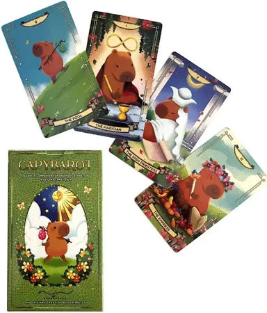 Five Capybarot Tarot Cards by Blue Dog Posters—featuring capybara art like "The Fool" and "The Magician"—are shown beside a green box decorated with capybara and angel designs.
