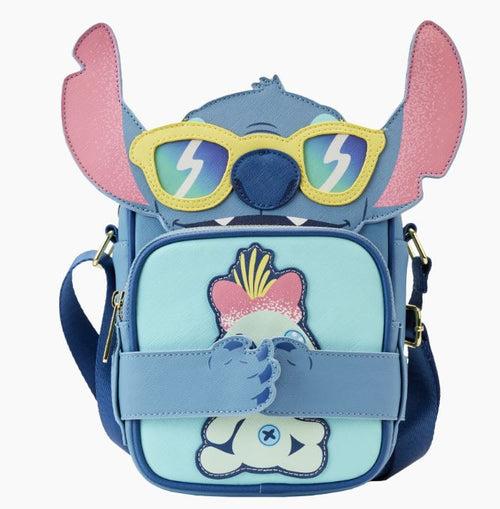 This whimsical crossbody bag, the Lilo & Stitch - Stitch Beach Crossbuddy by Blue Dog Posters, is crafted from vegan leather and inspired by Loungefly Disney designs. It resembles a cartoon character with large pink ears and lightning bolt sunglasses, featuring a playful front pocket print and an adjustable strap for added flair on any Stitch Beach Day adventure.