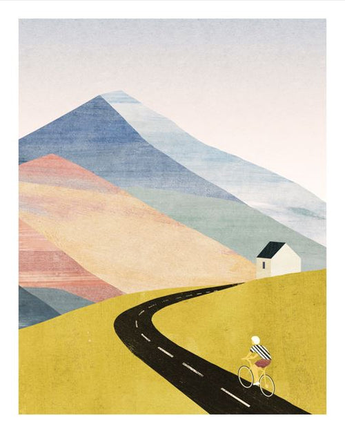 Cycling Home by Henry Rivers from GAL210K: a minimalist art print featuring a cyclist on a winding road through yellow hills, with a white house and blue pastel mountains beneath a pale sky.