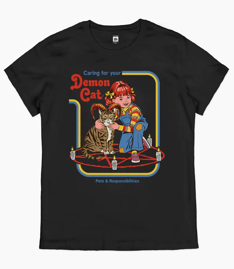 This stylish Demon Cat T-Shirt in black (medium) from Blue Dog Posters showcases a vibrant graphic of a red-haired child petting a tiger-striped cat with a forked tail and horns. The text above the image reads, "Caring for your Demon Cat," while below it says, "Pets & Responsibilities." The duo is set within a pentagram. Express your love for unique designs and support the artist by wearing this distinctive tee!