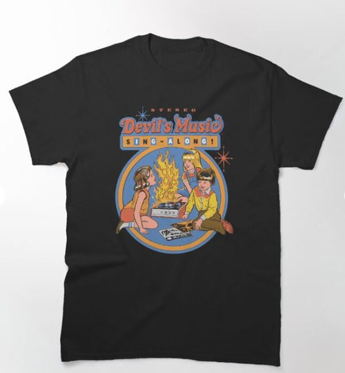 The Blue Dog Posters "Devils Music T-shirt Black 2XL" features a retro-style design by Steven Rhodes. It depicts three children gathered around a campfire, singing, with the text "Stereo Devil's Music Sing-Along" above them in colorful, playful font, and stars adorning the background.