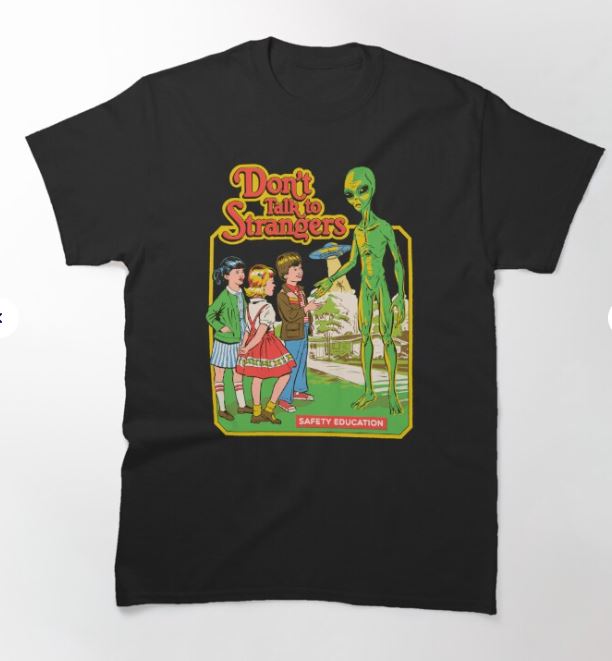 Introducing the "Don't Talk to Strangers T-shirt" from Blue Dog Posters. This black tee in XL features a vibrant, vintage-style illustration of three children—two girls and a boy—engaging with a green alien who seems to be talking to them. The text above the image states "Don't Talk to Strangers," while below it reads "Safety Education." Ideal for fans of Steven Rhodes T-Shirts!