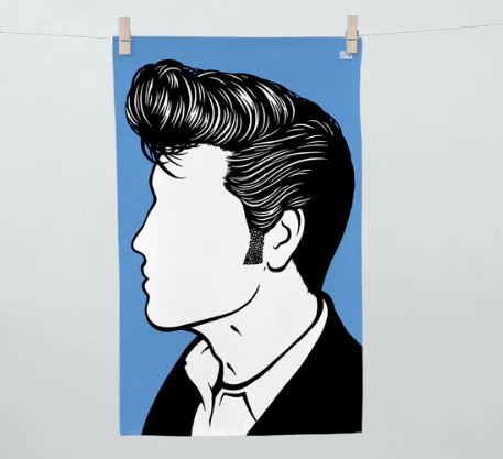 An illustration depicts a profile view of a person sporting styled hair, sideburns, and a collared shirt against a blue background. The face is left featureless and blank to highlight the hairstyle and outfit. This image is showcased on the "Rock and Pop Icons Tea Towel Elvis" by Blue Dog Posters, clipped alongside other 100% cotton tea towels, radiating simplicity and style.