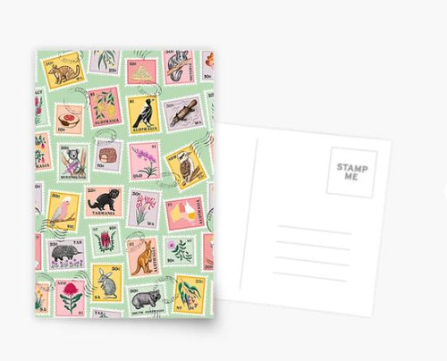 The G'Day from Australia Postcard by Blue Dog Posters is a postcard and envelope set showcasing a vibrant collection of stamps with diverse illustrations, such as animals, plants, and landscapes. The back of the postcard includes defined areas for a stamp and address, set against a white background.