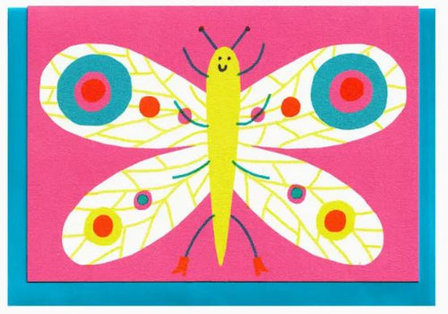 The Butterfly Riso Greeting Card by Blue Dog Posters features a colorful illustration of a smiling butterfly set against a bright pink background. The butterfly boasts a yellow body, with its wings adorned in vibrant circles and patterns of blue, red, and green. A teal frame borders the image, making this card perfect for spreading cheer.