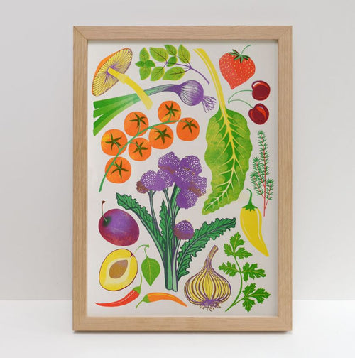 Home Grown Riso Print by Printer Johnson from Blue Dog Posters features a framed illustration of vibrant vegetables and fruits, such as mushrooms, strawberries, cherry tomatoes, garlic, leafy greens, cherries, plums, avocadoes, broccoli, onions, herbs, and chili peppers on a white background.