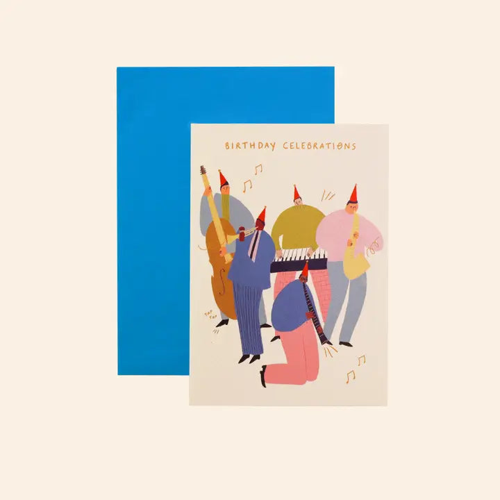 The Jazz Birthday Celebrations Greeting Card by Blue Dog Posters features illustrated musicians in colorful party outfits with instruments under the text "Birthday Celebrations," and comes with a bright blue envelope.