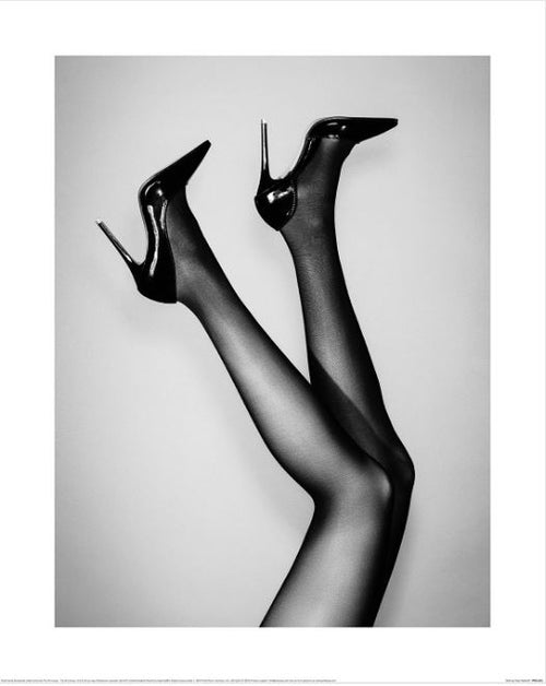 The 1 X Studio III (Kick Up Your Heels) art print by GAL203 features elegant legs in black stockings and glossy high heels against a light gray background, making it a perfect addition to any decor series.