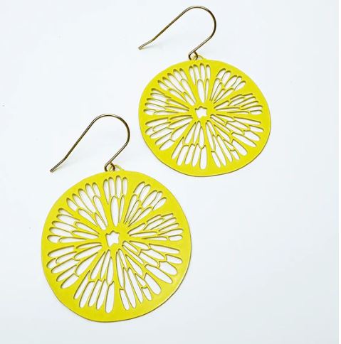 The Denz Citrus Slice Earrings in Lemon by Blue Dog Posters feature a bright yellow finish and delicate cut-out designs like citrus slices, each attached to a simple hook against a plain white background.