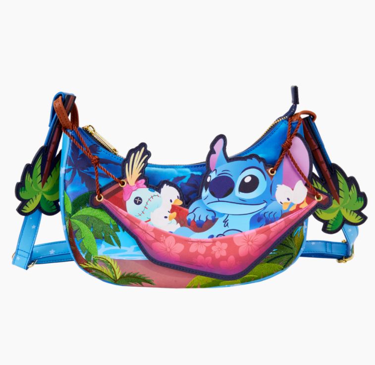 The Lilo & Stitch Camping Cuties Crossbody Bag by Blue Dog Posters showcases a colorful illustration of Stitch lounging in a pink hammock suspended between two palm trees, set against a tropical foliage background. The bag features blue straps and zipper detailing.