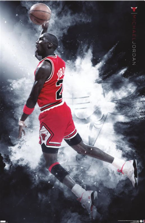 A basketball player in a red uniform with the number 23 on it leaps high for a one-handed dunk against a smoky, dynamic background with abstract elements. "Michael Jordan" is displayed vertically on the right side. This vibrant basketball poster, titled "Michael Jordan - Burst," is part of the SPO 005 Sport Collection and printed on premium 150gsm gloss paper.