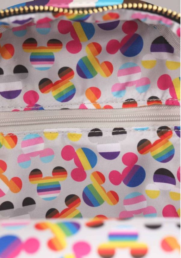 The interior lining of the Disney Mickey Pride Cosplay Mini Backpack by Blue Dog Posters is highlighted with a vivid pattern featuring Mickey Mouse ears. These iconic ears are beautifully decorated with different Pride flag colors, such as rainbow and additional stripes, all set against a white background. A central zippered pocket stands out in the design.