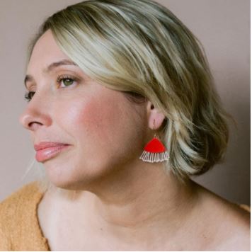 A woman with short blonde hair wears Blue Dog Posters' Mini Gum Blossom Strawberry & Cream Earrings. She looks to the side with natural makeup and a light brown top, set against a neutral background.