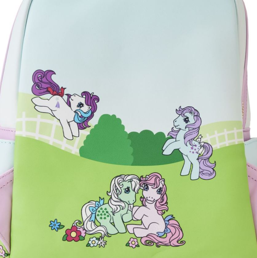 Celebrate in style with the My Little Pony Stable Mini Backpack by Blue Dog Posters. This pastel-colored bag features cartoon ponies from My Little Pony frolicking in a grassy field. With vibrant hues of purple, pink, and green, they play among flowers and a charming white picket fence.