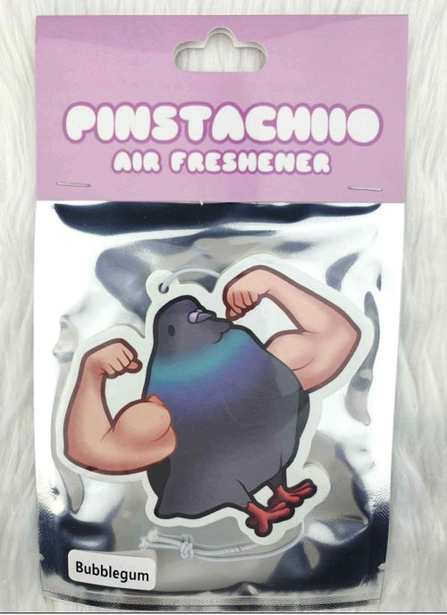 Blue Dog Posters' Muscle Pigeon Bubblegum Air Freshener - Pinstachiio is a packaged air freshener made in Australia, featuring an illustrated pigeon with muscular human arms flexing. The packaging showcases a purple header and the label "Pinstachhio Air Freshener" on a background of silky white fabric, exuding a delightful bubblegum fragrance.