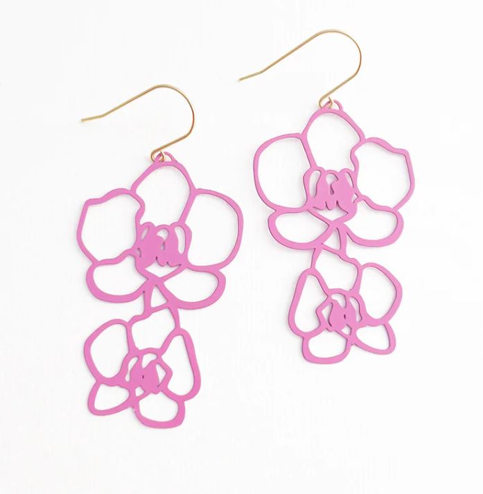 The Orchid Dangle Earrings in Pink by Blue Dog Posters showcase two floral-shaped earrings made from recycled stainless steel. Featuring a minimalist design and gold hooks, these lightweight earrings emulate the delicate appearance of orchid flowers with an open, airy aesthetic.