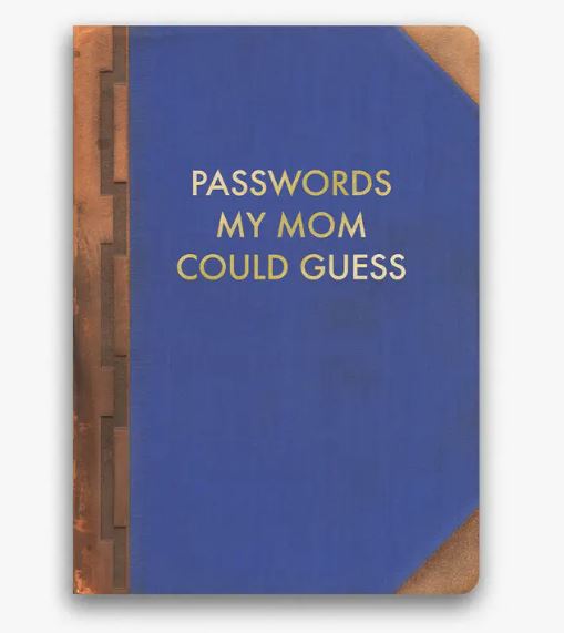 A notebook with a blue cover and brown edges, featuring a gold foil-stamped title "Passwords My Mum Could Guess." This 120-page passwords journal by Blue Dog Posters is both stylish and practical.