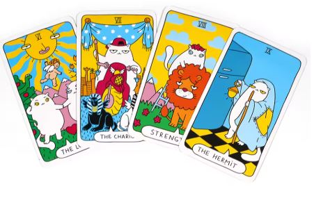 The Cat Paws Tarot Cards by Blue Dog Posters showcase four whimsical tarot cards: The Lovers in the sun, The Chariot on a motorcycle, Strength with a lion, and The Hermit holding a lantern in blue robes. Colors are vibrant and playful.